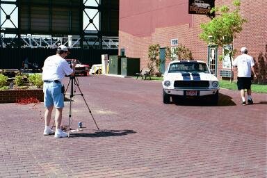 Keith readies the camera as helper Chaffin walks to the driver's side of a Mustang